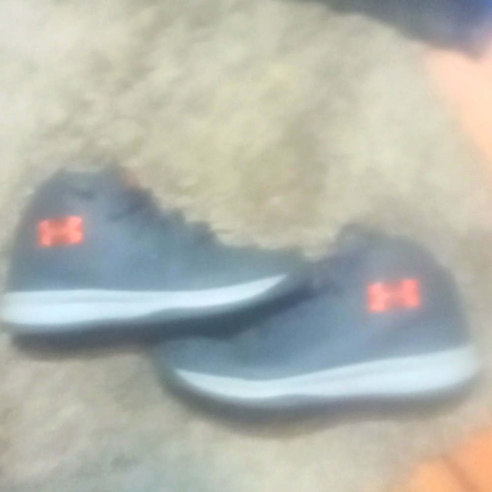 Under armor shoes size four dark grey in color.